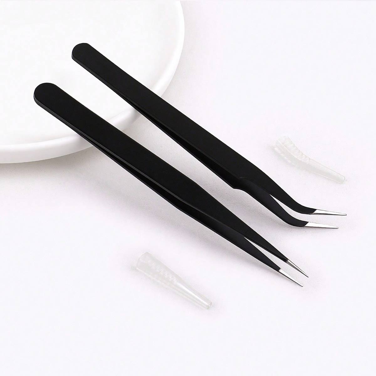 One curved eyelash tweezer and one straight eyelash tweezer