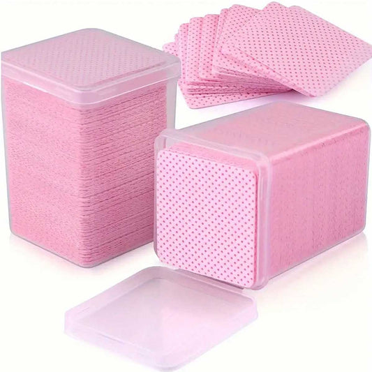 A box of square Glue Wipes