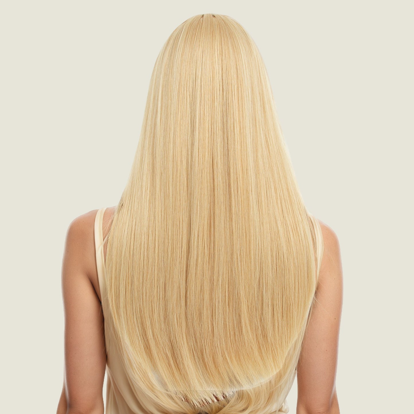Layered collarbone-length wig with dyed bangs and realistic long straight hair
